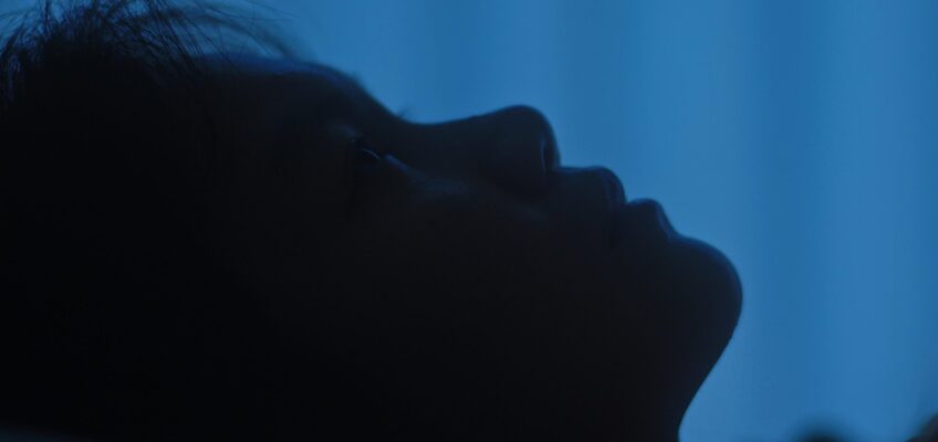 Person sleeping with digital health monitoring data overlay