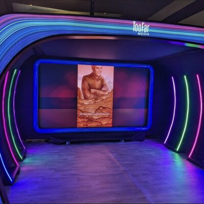 SXSW Emerging Tech Expo exhibition floor with technology displays and lighting installation