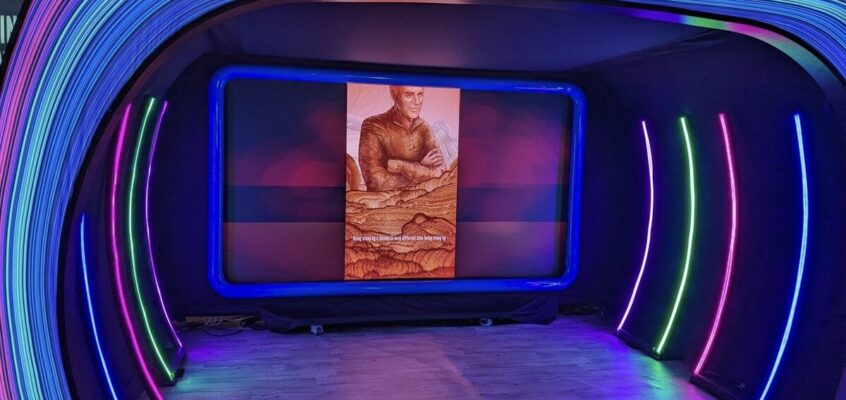 SXSW Emerging Tech Expo exhibition floor with technology displays and lighting installation