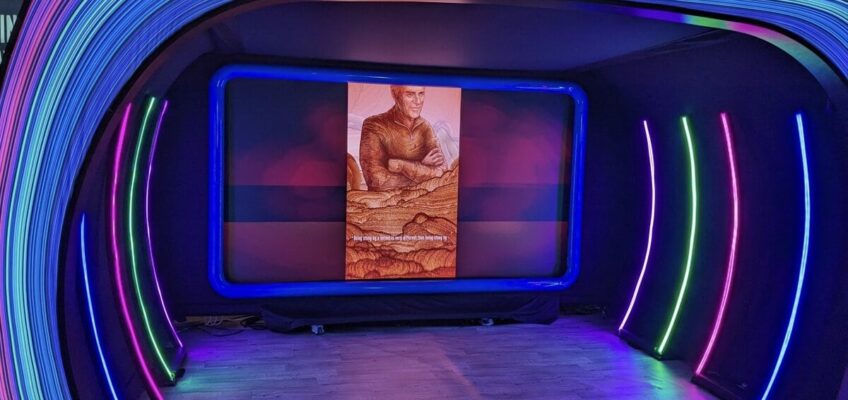 SXSW Emerging Tech Expo exhibition floor with technology displays and lighting installation