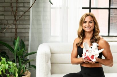 Dr. Caroline Packard of Connect Pelvic Floor Fitness holding an anatomical pelvis model